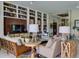 Cozy living room with built-in bookshelves, stylish furniture, and plenty of natural light at 9979 Winnington St, Orlando, FL 32832