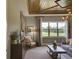 Inviting living room featuring coffered ceilings, neutral decor, and scenic views at 9979 Winnington St, Orlando, FL 32832
