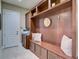 Functional mudroom with custom built-ins, bench seating, and ample storage space at 9979 Winnington St, Orlando, FL 32832
