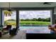 Outdoor space overlooking a golf course and a beautiful pool at 9979 Winnington St, Orlando, FL 32832