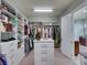 Walk-in closet with custom shelving and storage solutions for organization at 9979 Winnington St, Orlando, FL 32832