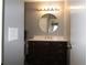 Nicely updated bathroom with a new vanity, modern mirror, and updated lighting at 1019 S Hiawassee Rd # 3811, Orlando, FL 32835