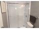 Bright bathroom featuring a new shower with white subway tile and glass doors at 1019 S Hiawassee Rd # 3811, Orlando, FL 32835