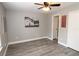 This bright bedroom features wood-look flooring and plenty of natural light at 1019 S Hiawassee Rd # 3811, Orlando, FL 32835