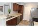 Tastefully updated kitchen with dark cabinets, stainless appliances and granite countertops at 1019 S Hiawassee Rd # 3811, Orlando, FL 32835