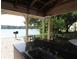 Outdoor kitchen boasts granite countertops, lake view, and barbecue, perfect for entertaining friends and Gathering at 1019 S Hiawassee Rd # 3811, Orlando, FL 32835