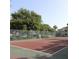 Community tennis court surrounded by lush trees and landscaping offering recreational opportunities for residents at 1019 S Hiawassee Rd # 3811, Orlando, FL 32835