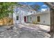 Spacious backyard features a brick paver patio, stone landscaping, and mature trees at 1021 S Elm Ave, Sanford, FL 32771