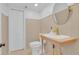 Stylish half bath with charming vanity and paint color at 1021 S Elm Ave, Sanford, FL 32771