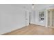 Bright bedroom featuring light hardwood floors, a built-in bookshelf, and natural light at 1021 S Elm Ave, Sanford, FL 32771