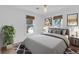 Stylishly decorated bedroom with white walls, modern art, and a plush bed at 1021 S Elm Ave, Sanford, FL 32771
