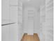 Walk-in closet with custom shelving and drawers for optimal storage solutions at 1021 S Elm Ave, Sanford, FL 32771