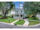 Charming two-story home featuring a quaint front porch and well-maintained landscaping in a peaceful neighborhood setting at 1021 S Elm Ave, Sanford, FL 32771