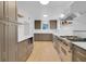 Spacious kitchen with gray cabinets, white countertops, stainless steel appliances, and an open layout at 1021 S Elm Ave, Sanford, FL 32771