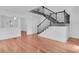 Living room featuring hardwood floors and staircase at 1021 S Elm Ave, Sanford, FL 32771