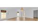 Empty main bedroom featuring wood floors, neutral tones, modern decor, and ample natural light, creating a serene retreat at 1021 S Elm Ave, Sanford, FL 32771