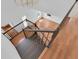View looking down on staircase with black rails and light-colored hardwood floors at 1021 S Elm Ave, Sanford, FL 32771