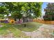 This home offers a private backyard, putting green, screened patio and lush landscaping at 1103 Lake Legro Ct, Orlando, FL 32835