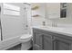 Modern bathroom with a shower, tub, vanity, and ample natural light creates a spa-like retreat at 1103 Lake Legro Ct, Orlando, FL 32835