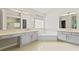 Bright bathroom offers dual vanities, a soaking tub, and windows for a serene atmosphere at 1103 Lake Legro Ct, Orlando, FL 32835