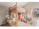 Charming bedroom featuring a loft bed with storage and a cozy study area at 1103 Lake Legro Ct, Orlando, FL 32835