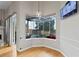 Bright breakfast nook with hardwood floors and a view of the screened-in patio at 1103 Lake Legro Ct, Orlando, FL 32835
