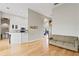 Open-concept living area with hardwood floors, leading to the kitchen at 1103 Lake Legro Ct, Orlando, FL 32835