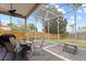 Enjoy outdoor living in this screened patio with fan, furniture and views of the backyard at 1103 Lake Legro Ct, Orlando, FL 32835