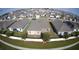 Aerial view showcasing the layout of a well planned neighborhood with homes, sidewalks, and landscaping at 1105 Citrus Landings Blvd, Davenport, FL 33837