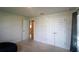 Comfortable bedroom featuring neutral walls and plush carpeting for a cozy atmosphere at 1105 Citrus Landings Blvd, Davenport, FL 33837