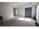 A bright bedroom featuring plush carpet, curtains, and natural light from a window at 1105 Citrus Landings Blvd, Davenport, FL 33837