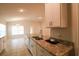 Bright kitchen featuring a large island and an open concept design to the dining and living areas at 1105 Citrus Landings Blvd, Davenport, FL 33837