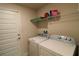Functional laundry room features a side-by-side washer and dryer for convenience at 1105 Citrus Landings Blvd, Davenport, FL 33837