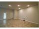 Bright, open living room with recessed lighting, tile floors, and doors to the exterior at 1105 Citrus Landings Blvd, Davenport, FL 33837