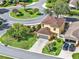 Aerial view of bright home in a cul-de-sac with mature landscaping at 12347 Ne 52Nd Loop, Oxford, FL 34484