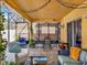 Comfortable screened-in patio with ample seating and decorative plants at 12347 Ne 52Nd Loop, Oxford, FL 34484