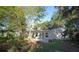 Spacious backyard featuring mature trees, a patio, and views of natural Florida landscape at 139 Stoney Ridge Dr, Longwood, FL 32750