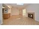 Open living room with tile flooring, fireplace, and a light-filled atmosphere at 139 Stoney Ridge Dr, Longwood, FL 32750