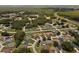 Overhead view of a community with lots of trees, yards, and quiet streets at 1457 Teal Dr, Kissimmee, FL 34759