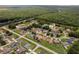 An aerial view showcasing a residential community near a forest at 1457 Teal Dr, Kissimmee, FL 34759
