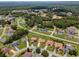 An aerial view of a residential area surrounded by trees and landscaping at 1457 Teal Dr, Kissimmee, FL 34759