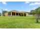 Large backyard with ample space, a screen room, and exterior building paint matching the house at 1457 Teal Dr, Kissimmee, FL 34759
