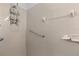 Bright bathroom featuring tiled walls and an adjustable shower head at 1457 Teal Dr, Kissimmee, FL 34759