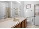 Clean bathroom features a large mirror, vanity, and walk-in shower at 1457 Teal Dr, Kissimmee, FL 34759