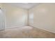 Bright bedroom features neutral walls, carpet, and a window with coverings at 1457 Teal Dr, Kissimmee, FL 34759