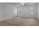 Neutral bedroom featuring carpet flooring and natural light from windows at 1457 Teal Dr, Kissimmee, FL 34759