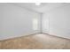 Bedroom shows a neutral color palette, carpet and a window with coverings at 1457 Teal Dr, Kissimmee, FL 34759