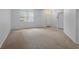 Spacious living room with neutral carpet, natural light, and a bright, airy feel at 1457 Teal Dr, Kissimmee, FL 34759