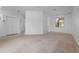 Spacious living room with neutral carpet and ample natural light at 1457 Teal Dr, Kissimmee, FL 34759