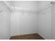 Spacious walk-in closet includes white walls, brown carpeting and wire rack shelving at 1457 Teal Dr, Kissimmee, FL 34759
